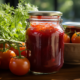 a_glass_jar_filled_with_homemade_tangy_tomato_ketchup_f88d96d4-d716-4152-bbdb-0a30ecfa783e